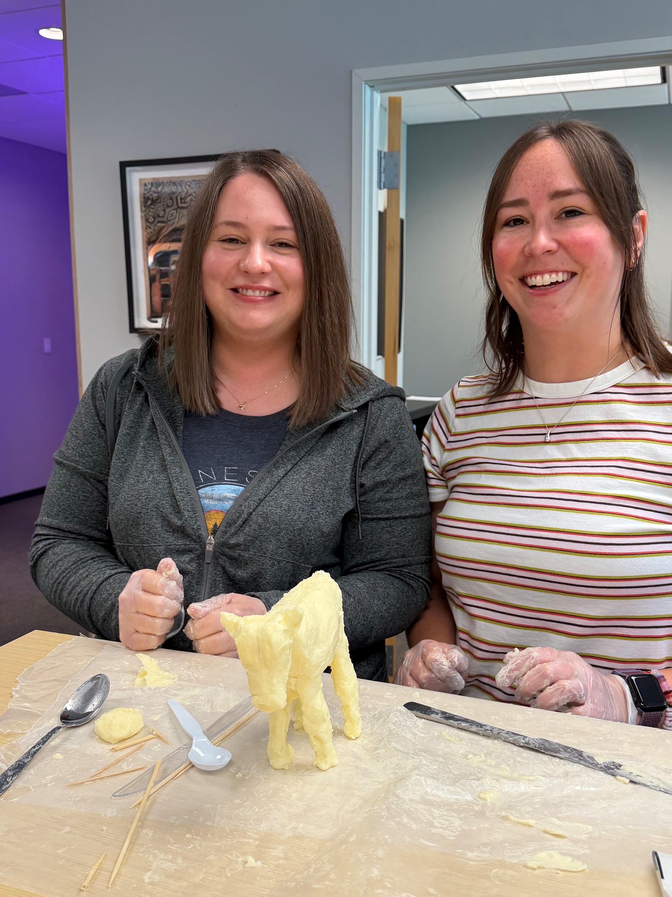 Erin and Krista with their blue ribbon winning butter cow