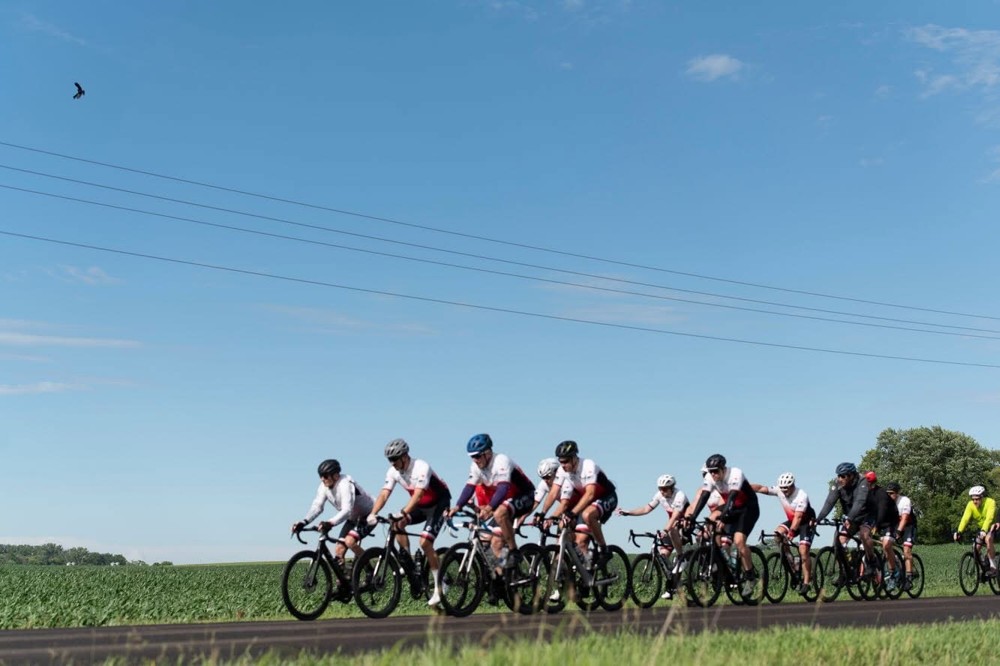 Break the Cycle riders cycling together along a country road