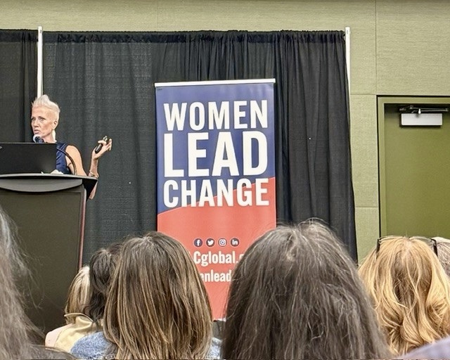 Beth Shelton, CEO of Girl Scouts of Iowa, speaking at the Women Lead Change podium